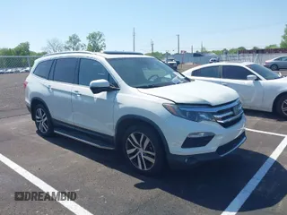 2017 Honda Pilot Touring with VIN 5FNYF5H96HB036547, listed as a IAAI auction lot 42058142 with 161,828 mi miles. Bid and sale history available at carsss.com. Image 1.