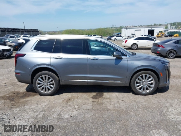 2022 Cadillac XT6 Premium Luxury z VIN 1GYKPDRS4NZ146284, wystawiony jako IAAI lot #42150678 z przebiegiem 28 890 mil mil oraz . Historia ofert i sprzedaży dostępna na DreamBid. Obrazek 14.