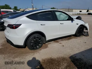 2023 Tesla Model Y Long Range with VIN 7SAYGDEE6PA053274, listed as a Copart auction lot 52865175 with Not Provided miles and Salvage Title. Bid and sale history available at DreamBid. Image 3.