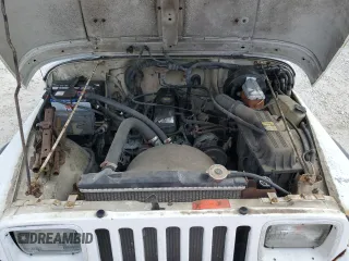 1995 Jeep Wrangler S z VIN 1J4FY19PXSP283293, wystawiony jako Copart lot #55553965 z przebiegiem 178 576 mil mil oraz Czysty tytuł • Clean title. Historia ofert i sprzedaży dostępna na DreamBid. Obrazek 11.