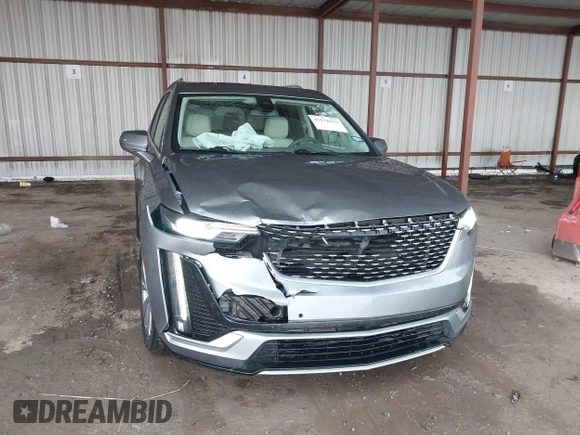 2022 Cadillac XT6 Premium Luxury z VIN 1GYKPDRS1NZ108012, wystawiony jako IAAI lot #41178333 z przebiegiem 83 987 mil mil oraz . Historia ofert i sprzedaży dostępna na DreamBid. Obrazek 6.
