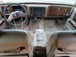 1991 Cadillac Brougham z VIN 1G6DW54EXMR701457, wystawiony jako Copart lot #70194104 z przebiegiem Nie podano mil oraz Nie do naprawy. Historia ofert i sprzedaży dostępna na DreamBid. Obrazek 8.