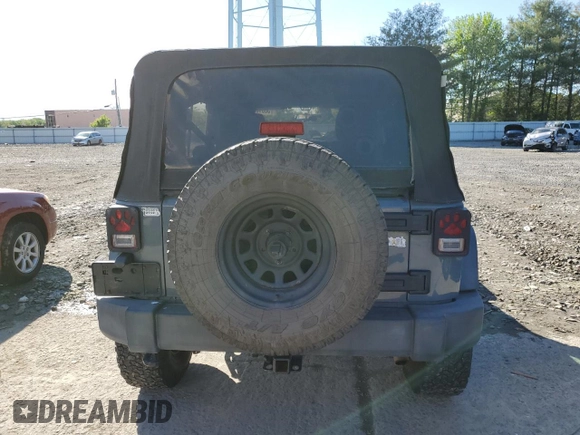 2015 Jeep Wrangler Unlimited Willys Wheeler with VIN 1C4BJWDG5FL609110, listed as a Copart auction lot 56013255 with 153,202 mi miles and Clean Title. Bid and sale history available at DreamBid. Image 6.