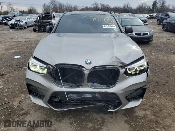 2021 BMW X4 M z VIN 5YMUJ0C03M9F20053, wystawiony jako Copart lot #87595845 z przebiegiem Nie podano mil oraz Szkody całkowita. Historia ofert i sprzedaży dostępna na DreamBid. Obrazek 5.