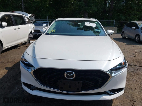 2022 Mazda 3 Carbon Edition with VIN 3MZBPACL0NM318573, listed as a IAAI auction lot 42403393 with 8,762 mi miles and . Bid and sale history available at DreamBid. Image 13.