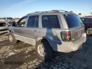 1999 Jeep Grand Cherokee Laredo with VIN 1J4GW58NXXC747537, listed as a Copart auction lot 87310234 with Not provided miles and Salvage title. Bid and sale history available at DreamBid. Image 2.