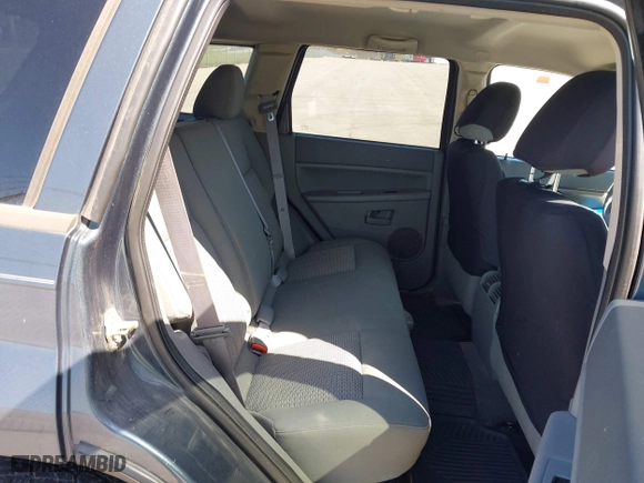 2007 Jeep Grand Cherokee Laredo with VIN 1J8GR48K07C561608, listed as a IAAI auction lot 41923454 with 230,351 mi miles. Bid and sale history available at carsss.com. Image 8.