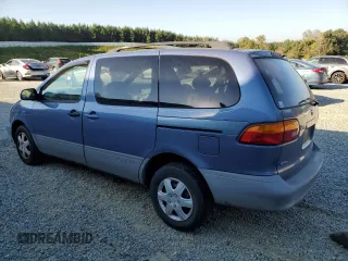 1999 Toyota Sienna LE with VIN 4T3ZF13C8XU108650, listed as a Copart auction lot 74476004 with 215,060 mi miles and Salvage Title. Bid and sale history available at carsss.com. Image 2.
