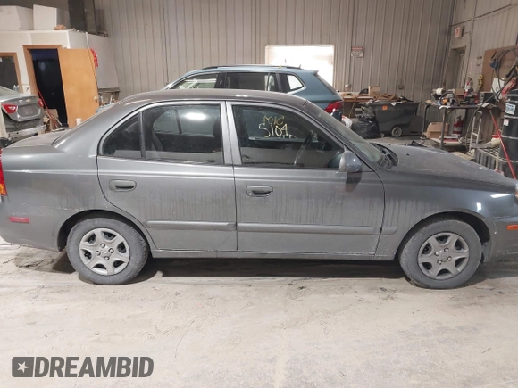 2004 Hyundai Accent GL with VIN KMHCG45C44U528783, listed as a IAAI auction lot 41535104 with 1 mi miles. Bid and sale history available at carsss.com. Image 13.
