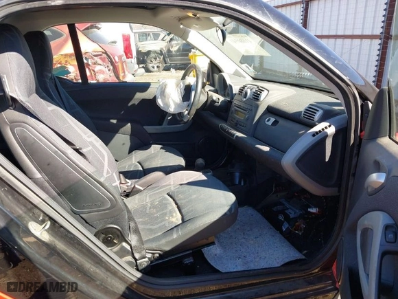 2008 Smart fortwo Pure with VIN WMEEJ31X28K122571, listed as a IAAI auction lot 41680541 with 63,673 mi miles. Bid and sale history available at carsss.com. Image 5.