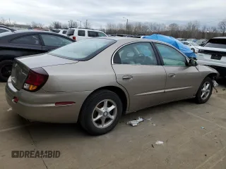 2002 Oldsmobile Aurora z VIN 1G3GR64H224169066, wystawiony jako Copart lot #44636565 z przebiegiem 69 419 mil mil oraz Szkody całkowita. Historia ofert i sprzedaży dostępna na DreamBid. Obrazek 3.