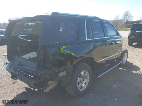 2015 GMC Yukon Denali with VIN 1GKS1CKJ3FR666601, listed as a IAAI auction lot 41946234 with 123,636 mi miles. Bid and sale history available at carsss.com. Image 4.