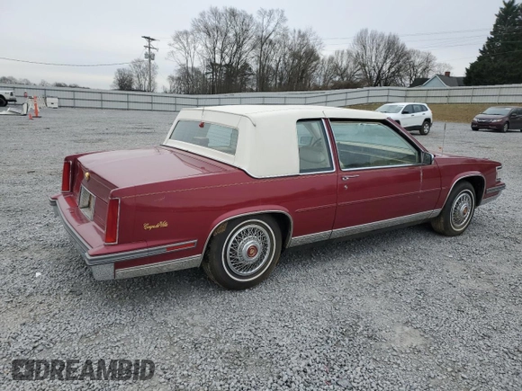 1987 Cadillac DeVille z VIN 1G6CD1181H4318101, wystawiony jako Copart lot #75354324 z przebiegiem Nie podano mil oraz Szkoda całkowita • Salvage title. Historia ofert i sprzedaży dostępna na DreamBid. Obrazek 3.