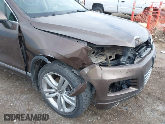 2013 Volkswagen Touareg Lux with VIN WVGEF9BP1DD012851, listed as a IAAI auction lot 41732391 with 123,283 mi miles and . Bid and sale history available at DreamBid. Image 6.