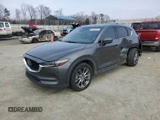 2019 Mazda CX-5 Signature with VIN JM3KFBEY3K0609305, listed as a Copart auction lot 44146455 with 33,104 mi miles and Salvage Title. Bid and sale history available at carsss.com. Image 1.