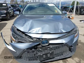 2021 Toyota Corolla Hybrid LE with VIN JTDEAMDE0MJ026601, listed as a IAAI auction lot 41797452 with 85,294 mi miles. Bid and sale history available at carsss.com. Image 12.