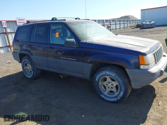 1997 Jeep Grand Cherokee Laredo z VIN 1J4GZ58Y2VC551199, wystawiony jako IAAI lot #42625502 z przebiegiem 210 722 mil mil oraz . Historia ofert i sprzedaży dostępna na DreamBid. Obrazek 1.