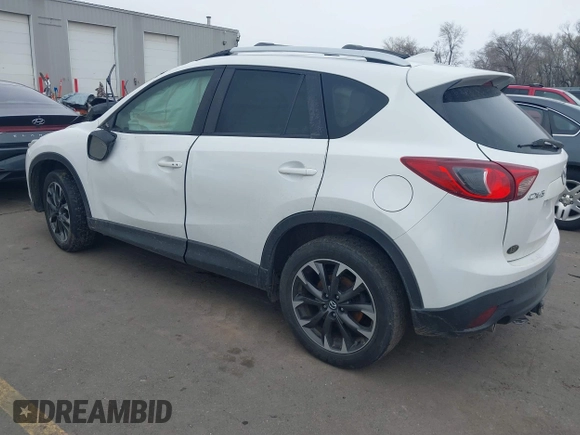 2016 Mazda CX-5 Grand Touring z VIN JM3KE2DY8G0885006, wystawiony jako IAAI lot #41615873 z przebiegiem 118 890 mil mil oraz . Historia ofert i sprzedaży dostępna na DreamBid. Obrazek 3.