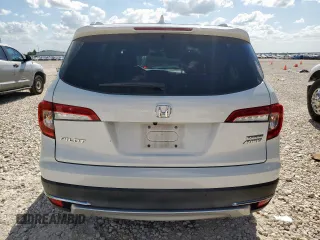 2020 Honda Pilot Touring 7-Passenger with VIN 5FNYF6H69LB018905, listed as a Copart auction lot 61209685 with 61,637 mi miles and Salvage title. Bid and sale history available at DreamBid. Image 6.
