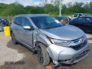 2018 Honda CR-V Touring with VIN 7FARW1H90JE012526, listed as a IAAI auction lot 42055078 with 96,098 mi miles and . Bid and sale history available at DreamBid. Image 1.
