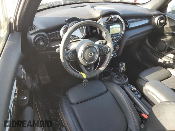 2020 MINI Hardtop Cooper S z VIN WMWXR5C04L2M16068, wystawiony jako Copart lot #53107645 z przebiegiem 43 810 mil mil oraz Szkody całkowita. Historia ofert i sprzedaży dostępna na DreamBid. Obrazek 8.