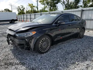 2017 Ford Fusion Hybrid Titanium z VIN 3FA6P0RU6HR250243, wystawiony jako Copart lot #60604065 z przebiegiem 156 675 mil mil oraz Szkoda całkowita • Salvage title. Historia ofert i sprzedaży dostępna na DreamBid. Obrazek 1.