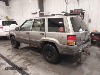 1998 Jeep Grand Cherokee Laredo with VIN 1J4GZ58S3WC343555, listed as a IAAI auction lot 41528943 with 219,146 mi miles. Bid and sale history available at carsss.com. Image 3.
