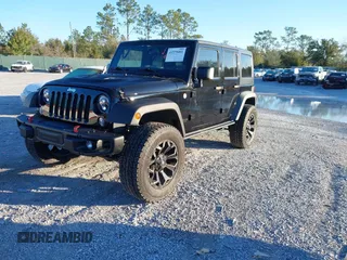 2015 Jeep Wrangler Unlimited Rubicon with VIN 1C4BJWFGXFL610153, listed as a IAAI auction lot 41575401 with 114,583 mi miles. Bid and sale history available at carsss.com. Image 17.