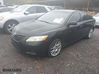 2007 Toyota Camry CE with VIN JTNBE46K573000686, listed as a IAAI auction lot 41971943 with 302,136 mi miles. Bid and sale history available at carsss.com. Image 2.