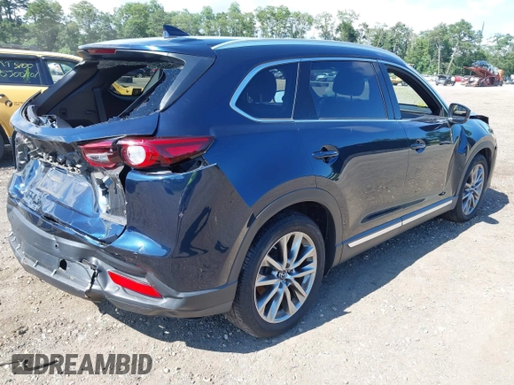 2019 Mazda CX-9 Grand Touring with VIN JM3TCBDY6K0335886, listed as a IAAI auction lot 42704250 with 37,171 mi miles and . Bid and sale history available at DreamBid. Image 4.