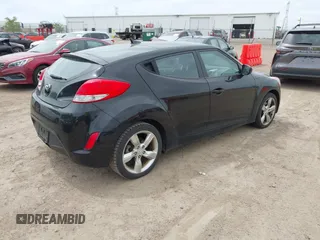 2013 Hyundai Veloster w/Gray Int with VIN KMHTC6AD6DU179826, listed as a IAAI auction lot 42151479 with 82,643 mi miles. Bid and sale history available at carsss.com. Image 4.
