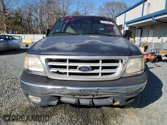 1999 Ford F-150 with VIN 1FTRX18W0XNC03906, listed as a Copart auction lot 42742555 with Not provided miles and Salvage title. Bid and sale history available at DreamBid. Image 5.