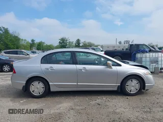 2007 Honda Civic with VIN JHMFA36267S028464, listed as a IAAI auction lot 42215413 with 121,682 mi miles and . Bid and sale history available at DreamBid. Image 13.