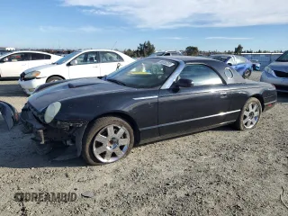 2005 Ford Thunderbird Deluxe with VIN 1FAHP60A35Y105382, listed as a Copart auction lot 88535235 with 104,112 mi miles and Salvage Title. Bid and sale history available at DreamBid. Image 1.