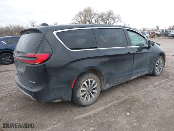 2023 Chrysler Pacifica Hybrid Touring L with VIN 2C4RC1L7XPR518209, listed as a IAAI auction lot 41038104 with 35,969 mi miles. Bid and sale history available at carsss.com. Image 4.