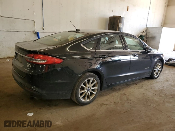 2017 Ford Fusion Hybrid SE z VIN 3FA6P0LU2HR247283, wystawiony jako Copart lot #62571495 z przebiegiem 167 042 mil mil oraz Nie do naprawy • Non repairable. Historia ofert i sprzedaży dostępna na DreamBid. Obrazek 3.