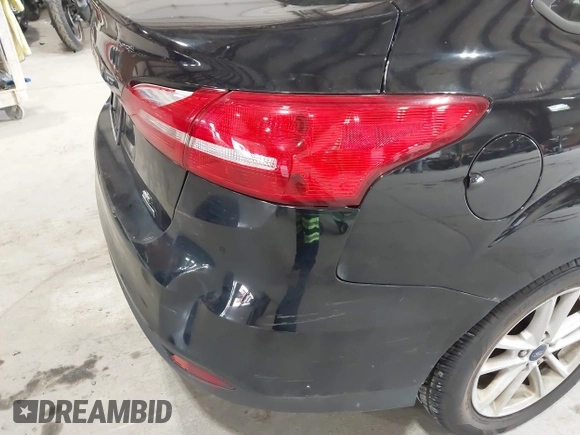 2018 Ford Focus SE with VIN 1FADP3FE8JL209560, listed as a IAAI auction lot 42707236 with 166,017 mi miles and . Bid and sale history available at DreamBid. Image 18.