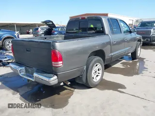 2001 Dodge Dakota z VIN 1B7HL2AX51S333575, wystawiony jako IAAI lot #41782582 z przebiegiem 291 640 mil mil oraz . Historia ofert i sprzedaży dostępna na DreamBid. Obrazek 4.