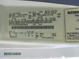 2011 Ford Econoline Cargo Commercial with VIN 1FTNE1EWXBDB18935, listed as a IAAI auction lot 42269977 with 240,545 mi miles and . Bid and sale history available at DreamBid. Image 9.