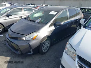 2017 Toyota Prius v Two with VIN JTDZN3EU6HJ057203, listed as a IAAI auction lot 41544512 with 116,663 mi miles. Bid and sale history available at carsss.com. Image 2.