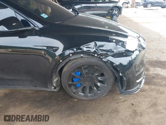 2023 Tesla Model Y Long Range with VIN 7SAYGDEE3PA185778, listed as a IAAI auction lot 39721611 with 11,986 mi miles and . Bid and sale history available at DreamBid. Image 6.