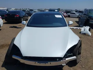 2023 Tesla Model S with VIN 5YJSA1E51PF499919, listed as a IAAI auction lot 42459166 with 6,612 mi miles and . Bid and sale history available at DreamBid. Image 13.