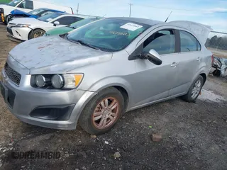 2013 Chevrolet Sonic LT with VIN 1G1JC5SH1D4205197, listed as a IAAI auction lot 41623803 with 153,666 mi miles and . Bid and sale history available at DreamBid. Image 2.