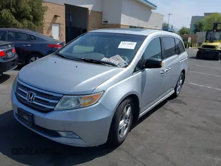 2012 Honda Odyssey Touring с VIN 5FNRL5H91CB004546, выставлен на аукционе IAAI как лот 42175002 с пробегом 118 719 миль миль и . История ставок и продаж доступна на DreamBid. Изображение 2.