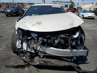 2024 Lexus UX with VIN JTHX6JBH7R2189588, listed as a Copart auction lot 70237664 with 9,963 mi miles and Salvage Title. Bid and sale history available at carsss.com. Image 5.