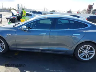 2014 Tesla Model S 60 with VIN 5YJSA1S15EFP29010, listed as a IAAI auction lot 41798180 with 142,754 mi miles and . Bid and sale history available at DreamBid. Image 14.