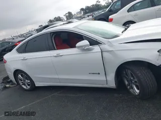 2015 Ford Fusion Titanium Hybrid with VIN 3FA6P0RU3FR247118, listed as a IAAI auction lot 41210219 with 143,348 mi miles. Bid and sale history available at carsss.com. Image 13.