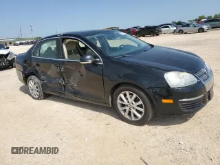 2010 Volkswagen Jetta SE with VIN 3VWRX7AJXAM049320, listed as a Copart auction lot 56142005 with 127,002 mi miles and Salvage title. Bid and sale history available at DreamBid. Image 4.