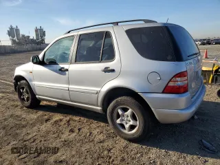2000 Mercedes-Benz M-Class with VIN 4JGAB54E6YA181947, listed as a Copart auction lot 77781524 with 165,399 mi miles and Salvage Title. Bid and sale history available at carsss.com. Image 2.