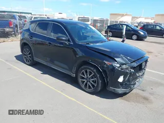 2018 Mazda CX-5 Touring z VIN JM3KFACM5J0309533, wystawiony jako IAAI lot #42195429 z przebiegiem 91 928 mil mil oraz . Historia ofert i sprzedaży dostępna na DreamBid. Obrazek 1.